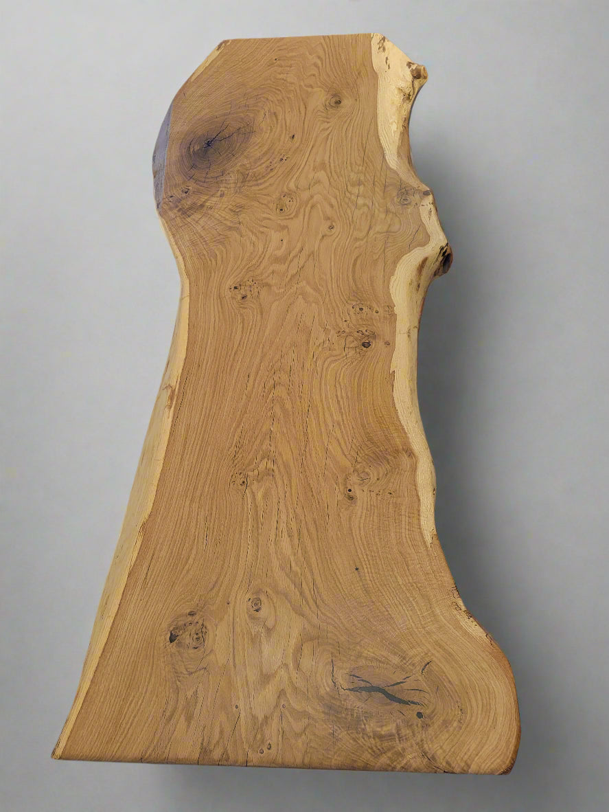 Wooden slab with natural grain pattern on a white surface