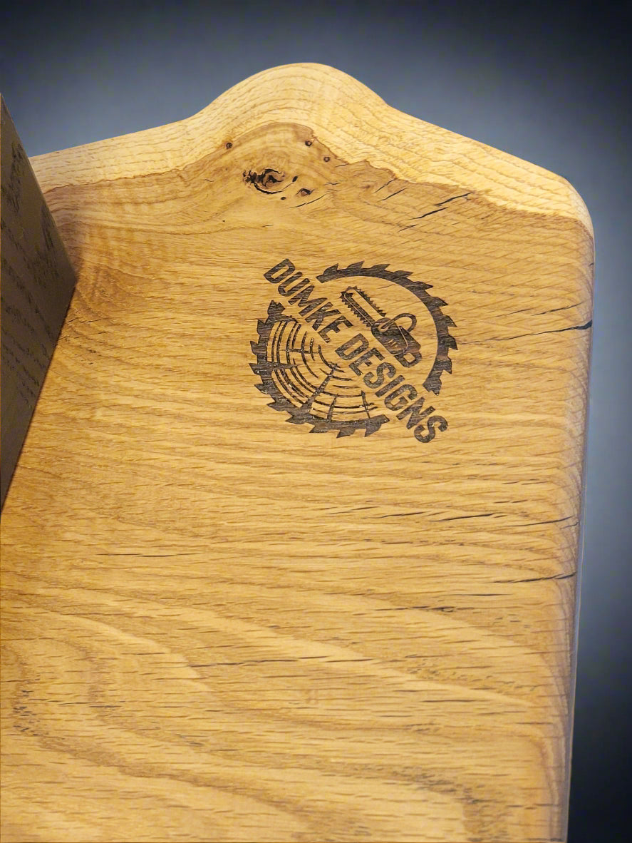 Wood slab with Dumke Designs brand logo